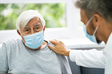 Doctor Talking To Elderly Patient