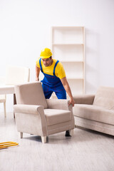 Young male contractor in relocation concept