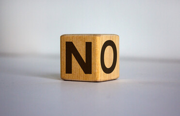 Wood block with word 'no' on beautiful white background, copy space. Business concept.