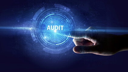 Hand touching AUDIT button, modern business technology concept