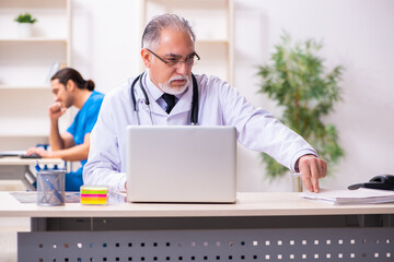 Two male doctors working in the clinic