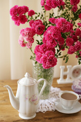 summer morning with the scent of roses and tea with milk
