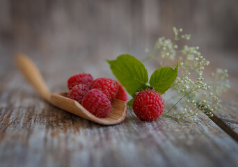 raspberries on wooden background