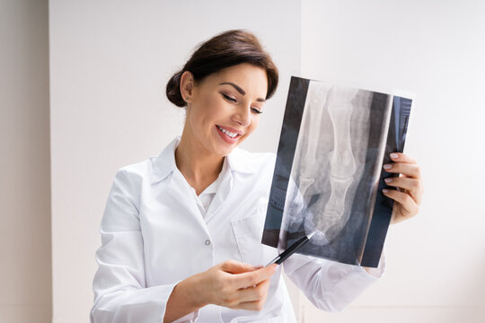 Female Doctor Holding Xray Scan Image