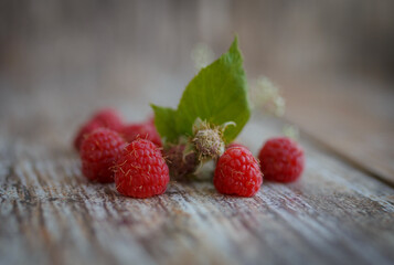 raspberries on wooden background