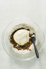 mixing sweet baking ingredients in a large glass bowl