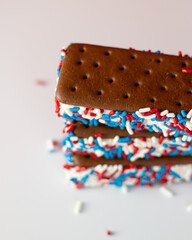 Chocolate ice cream sandwiches with red, white, and blue sprinkles 