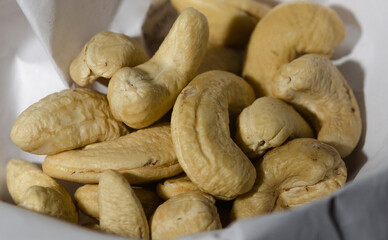 Heap of Raw Cashew Nuts on white background