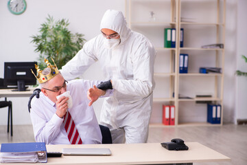 Old employee catching coronavirus at workplace