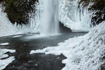 Horsetail falls  after a winter snow and ice storm.  The falls is in the Columbia River Gorge National Scenic Area, about 18 miles east of Portland, Oregon.
