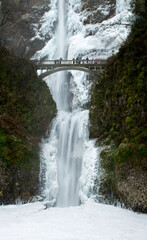 Columbia River Gorge, Oregon - 10/12/2013: Multnomah Falls and the trail bridge after a winter snow and ice stor,  The falls is in the Columbia River Gorge National Scenic Area.