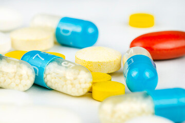 Background made of different kinds of colorful pills and tablets, macro shot.