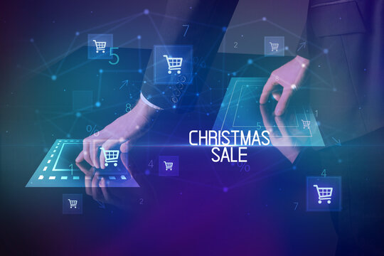 Online shopping with CHRISTMAS SALE inscription concept, with shopping cart icons