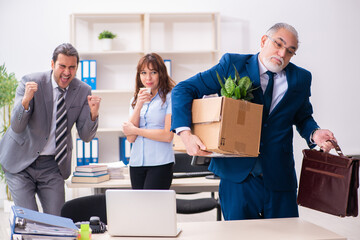 Two male and one female employees working in the office