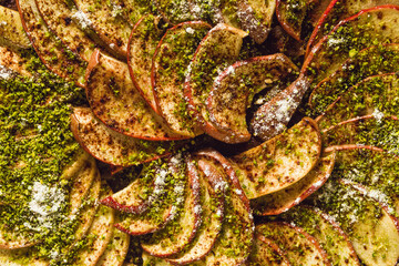 italian apple pie crostata with pistachio crumbs on the table with a white tablecloth