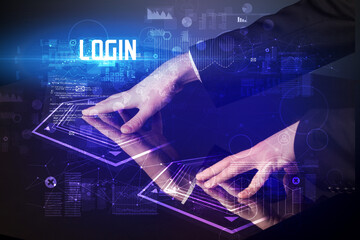 Hand touching digital table with LOGIN inscription, new age security concept