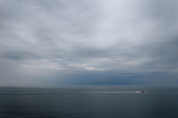 Canadian Coast Guard heading out of Yarmouth sound with stormy clouds