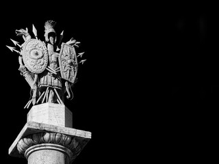 Ancient roman weapons and armors from 19th century neoclassical monument in People's Square in Rome...