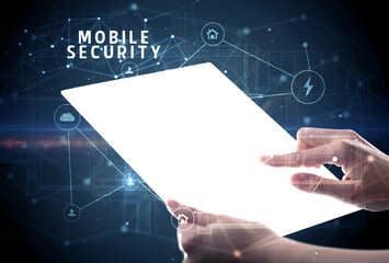 Holding futuristic tablet with MOBILE SECURITY inscription, cyber security concept