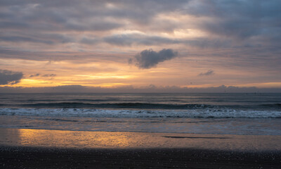 Sunset on the beach with clouds 
