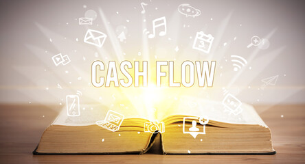 Opeen book with CASH FLOW inscription, business concept