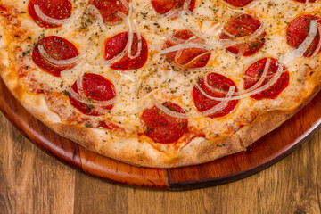pepperoni pizza on wooden background