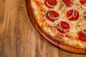 pepperoni pizza on wooden background