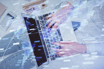 Double exposure of woman hands working on computer and data theme hologram drawing. Top View. Technology concept.