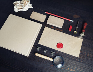 Photo of blank vintage stationery set on wooden background. Corporate identity mock up for placing...