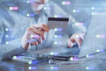 Double exposure of man hands holding a credit card and data theme drawing. E-commerce and...