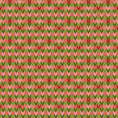 Seamless knitted pattern of pink, green and red. Handmade knitted textile imitation. Abstract geometric background. For Christmas design