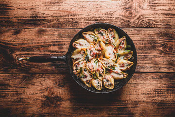 Skillet of stuffed jumbo shells pasta