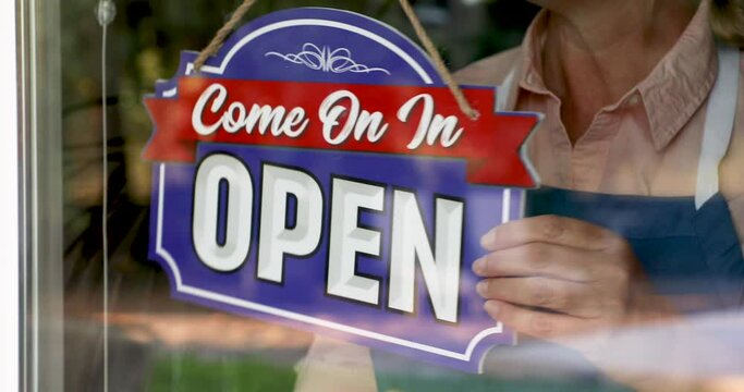 4k Female Shop Owner Flips Closed Sign To Open Ready for Business

