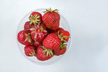 Fresh strawberries in a plastic Cup