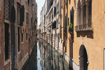 Narrow canal of Venice in Italy