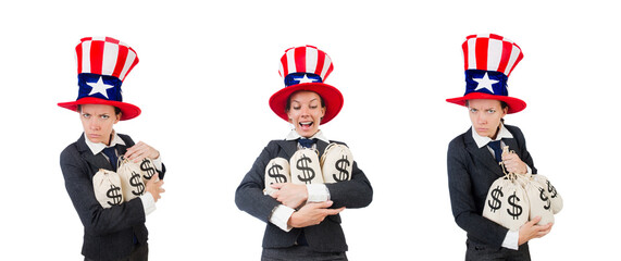 Businesswoman with sacks of money on white