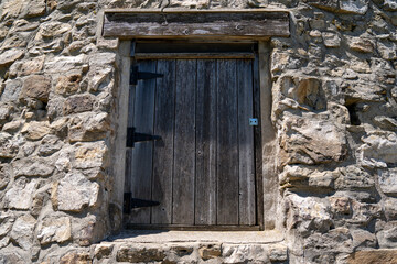 Close up of an old wooden window on stonewall. Taken at Seppmann Mill in Mankato Minnesota, useful...