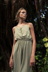 Fashionable portrait of a girl in the asian jungle.