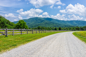 Farm road fence path in Roseland, Virginia near Blue Ridge parkway mountains in summer with idyllic rural landscape countryside in Nelson County - Powered by Adobe