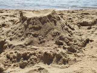 Tower a mountain of sand on the beach