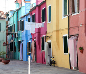Fototapeta na wymiar The island and village of Burano in Venice Italy with brightly colored buildings and canals