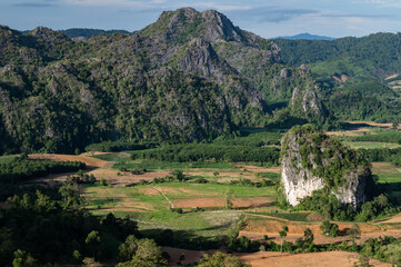 Fototapeta na wymiar The scenery view of limestone mountains in Phu Langka Forest Park during green season in Phayao province of Thailand.