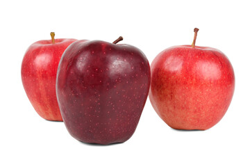 The dark red apple in front of the lighter colored apples isolated on white background. The difference is the leader concept.