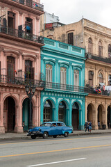 Fototapeta na wymiar Havana, Cuba in February 2018. Traditional and colorful old cars with old buildings in the background.