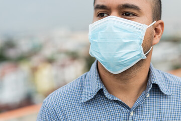 Close up young asian man wearing protection face mask against coronavirus.