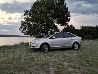 Fototapeta premium The car on the coast lake