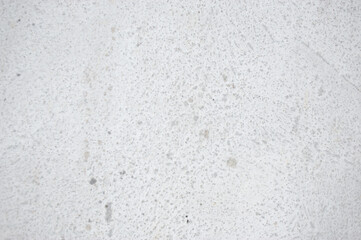 A white concrete background on a road in a no-parking area