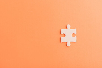 Top view flat lay of one paper plain white jigsaw puzzle game last pieces for solve, studio shot on...