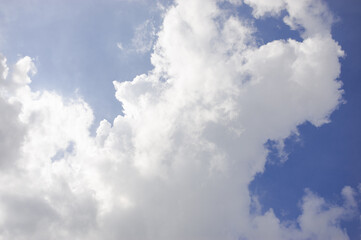 Fototapeta na wymiar Blue sky and white clouds with strange shapes