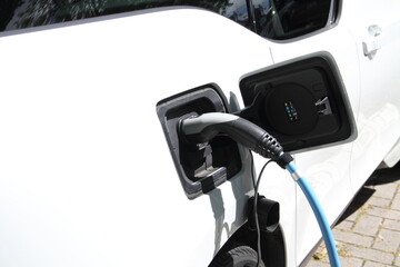 a car at an electric gas station